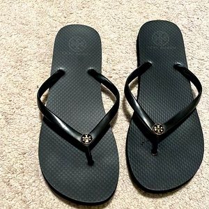 Tory Burch black and gold flip flops